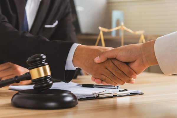 justice-and-law-concept-legal-law-advice-and-justice-businessman-handshake-with-a-lawyer-.jpg
